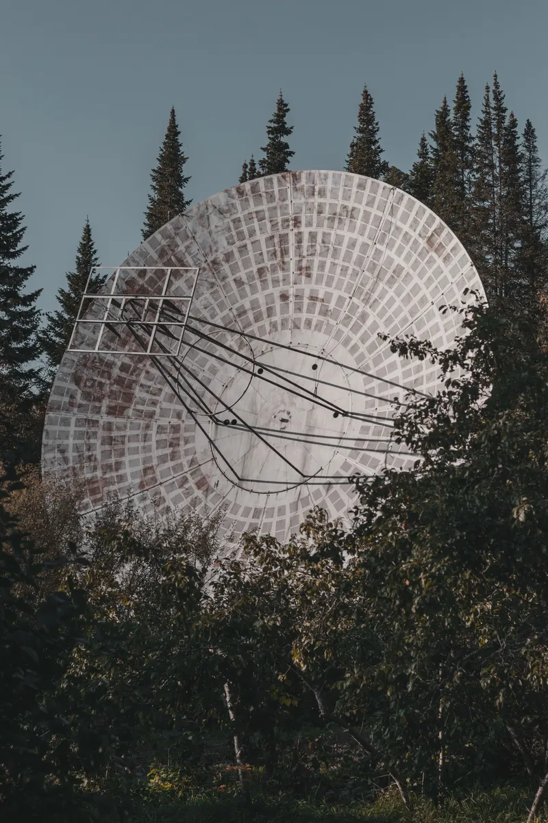 Field communications equipment in a remote location — layered connectivity from radio to satellite keeps conservation teams operational beyond cell coverage