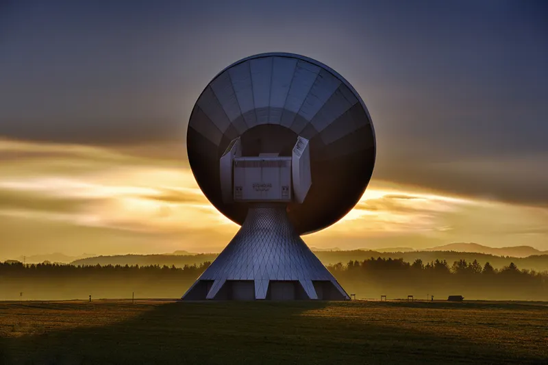 Satellite dish and communication equipment in a remote mountain setting — Starlink and satcom turn isolated camps into connected operations centres